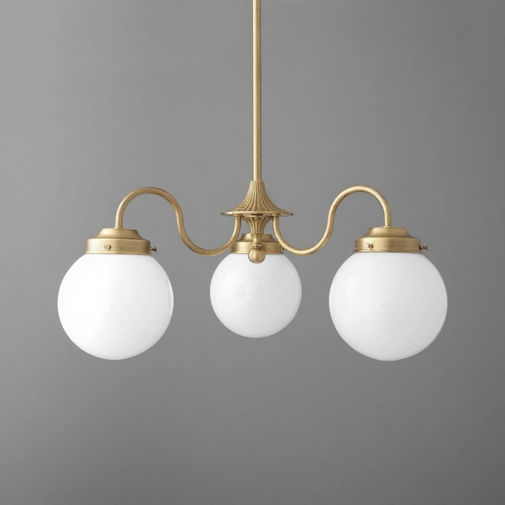 Three-light chandelier in antique brass finish with white globe glass shades and curved arms. - CHANDELIER MODEL NO. 5877