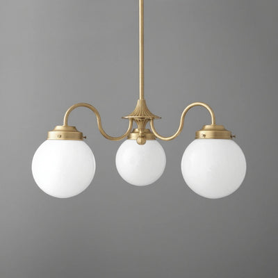 Three-light chandelier in antique brass finish with white globe glass shades and curved arms. - CHANDELIER MODEL NO. 5877