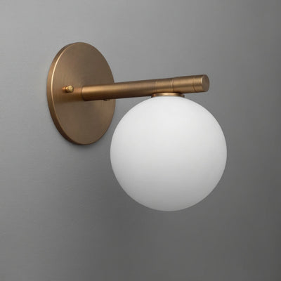 Wall sconce with sealed brass finish and frosted white glass globe shade. - SCONCE MODEL NO. 0904