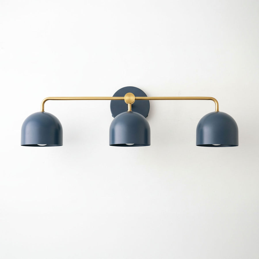 Mid-century modern vanity light with three deep blue metal shades and raw brass horizontal bar. - VANITY LIGHT MODEL NO. 7456