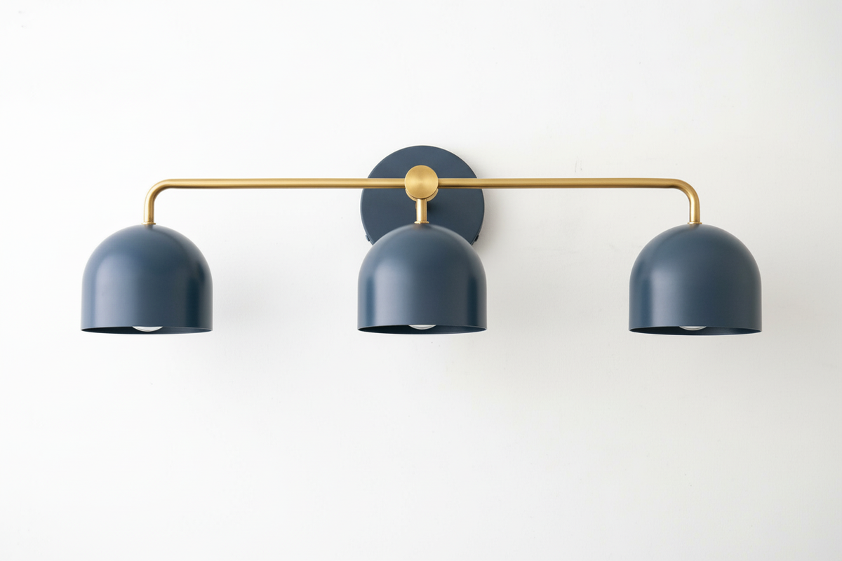 Mid-century modern vanity light with three deep blue metal shades and a brass-finished horizontal bar. - VANITY LIGHT MODEL NO. 7456