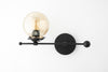 SCONCE MODEL No. 4353-Art Deco Wall Lights with a BlackGlobe on the Left finish. Designed and produced by DECOCREATIONStudio at Peared Creation