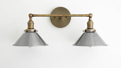 VANITY MODEL No. 0799- Industrial bathroom lighting with a Antique Brass finish. Designed and produced by newwineoldbottles at Peared Creation