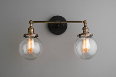 VANITY MODEL No. 5657- Industrial bathroom lighting with a Black/Antique Brass finish. Designed and produced by newwineoldbottles at Peared Creation