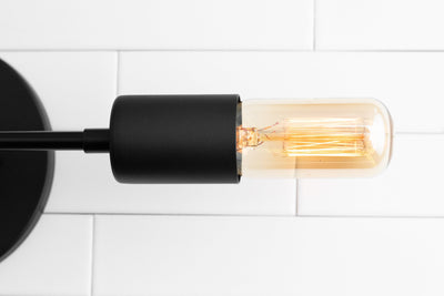 VANITY MODEL No. 5109- Industrial bathroom lighting with a Black finish. Designed and produced by newwineoldbottles at Peared Creation