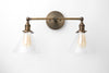 VANITY MODEL No. 1464- Industrial bathroom lighting with a Antique Brass finish. Designed and produced by newwineoldbottles at Peared Creation