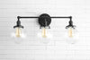 VANITY MODEL No. 3170- Industrial bathroom lighting with a Black finish. Designed and produced by newwineoldbottles at Peared Creation