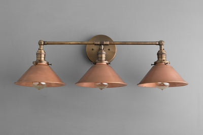 VANITY MODEL No. 2492- Industrial bathroom lighting with a Antique Brass finish. Designed and produced by newwineoldbottles at Peared Creation