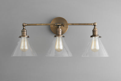 VANITY MODEL No. 4498- Industrial bathroom lighting with a Antique Brass finish. Designed and produced by newwineoldbottles at Peared Creation
