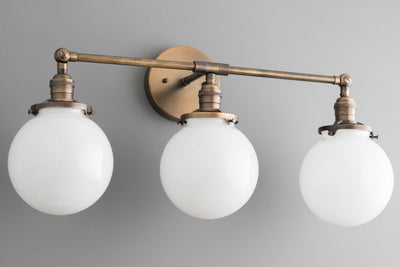VANITY MODEL No. 8241- Industrial bathroom lighting with a Antique Brass finish. Designed and produced by newwineoldbottles at Peared Creation