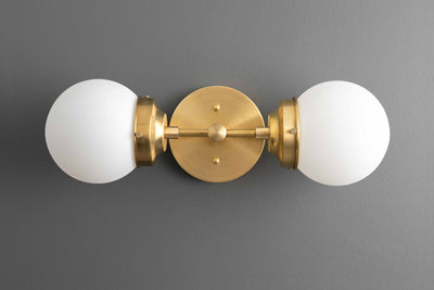 VANITY MODEL No. 2599-Art Deco bathroom lighting with a Raw Brass finish. Designed and produced by DECOCREATIONStudio at Peared Creation