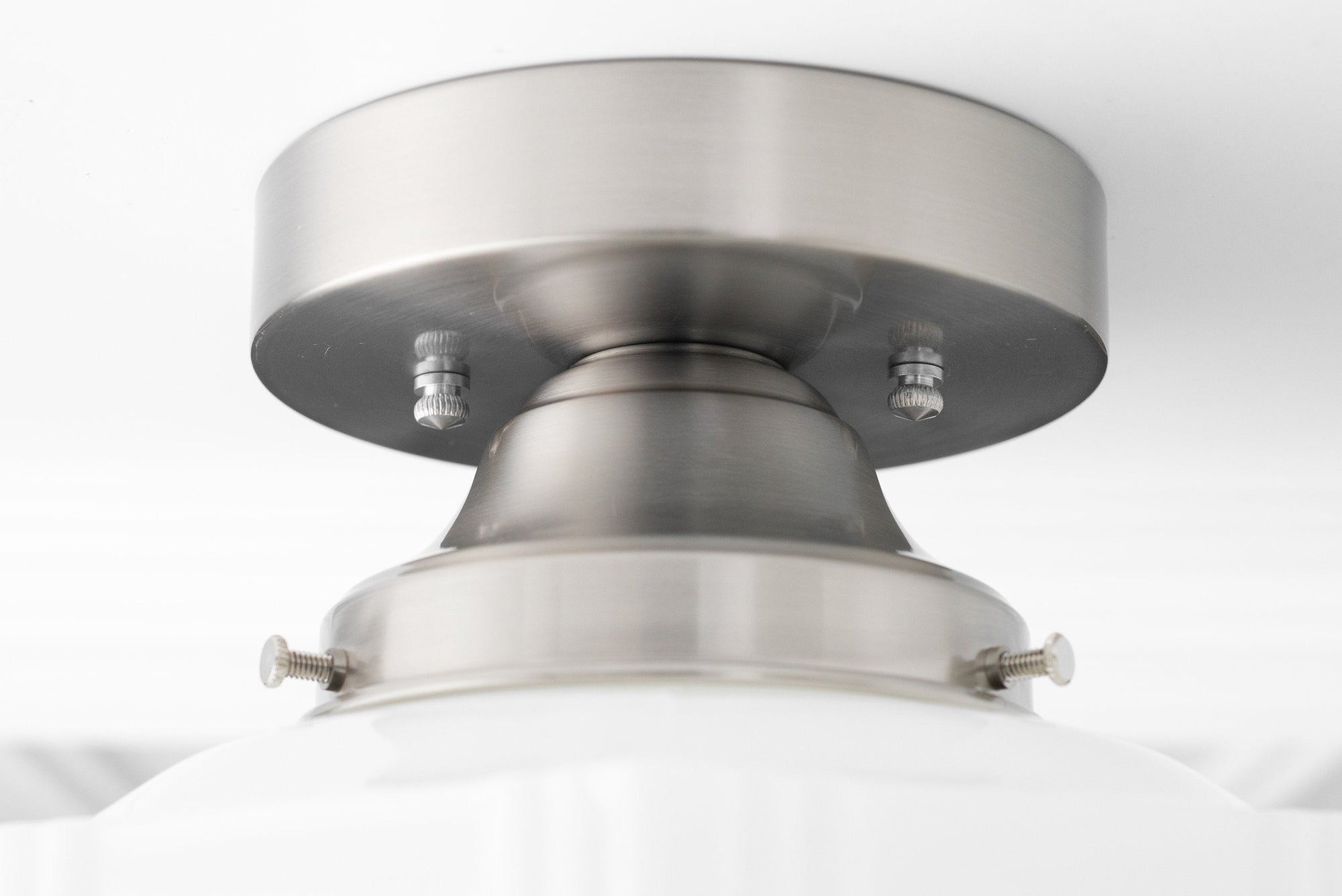 Brushed nickel flush mount ceiling light with globe diffuser and metal fixture details. - CEILING LIGHT MODEL NO. 9155