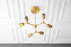 CHANDELIER MODEL No. 0445-Art Deco dining room light fixtures with a Raw Brass finish. Designed and produced by DECOCREATIONStudio at Peared Creation