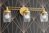 VANITY MODEL No. 8863-Art Deco bathroom lighting with a Raw Brass finish. Designed and produced by DECOCREATIONStudio at Peared Creation