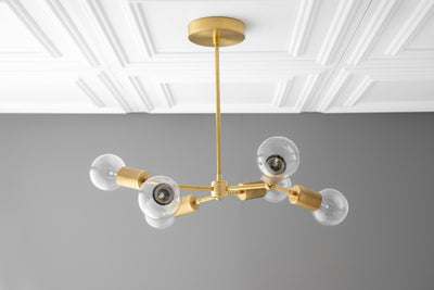 CHANDELIER MODEL No. 0445-Art Deco dining room light fixtures with a Raw Brass finish. Designed and produced by DECOCREATIONStudio at Peared Creation