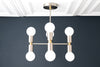 CHANDELIER MODEL No. 2724-Art Deco dining room light fixtures with a Black/Brass finish. Designed and produced by DECOCREATIONStudio at Peared Creation