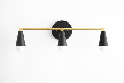 VANITY MODEL No. 9945- Mid Century Modern bathroom lighting with a Black/Brass/Black finish. Designed and produced by MODCREATIONStudio at Peared Creation