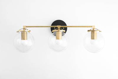 VANITY MODEL No. 4357- Mid Century Modern bathroom lighting with a Black/Brass finish. Designed and produced by MODCREATIONStudio at Peared Creation