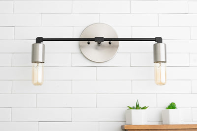 VANITY MODEL No. 3289- Industrial bathroom lighting with a Brushed Nickel/Black finish. Designed and produced by newwineoldbottles at Peared Creation