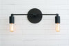 VANITY MODEL No. 3289- Industrial bathroom lighting with a Black finish. Designed and produced by newwineoldbottles at Peared Creation