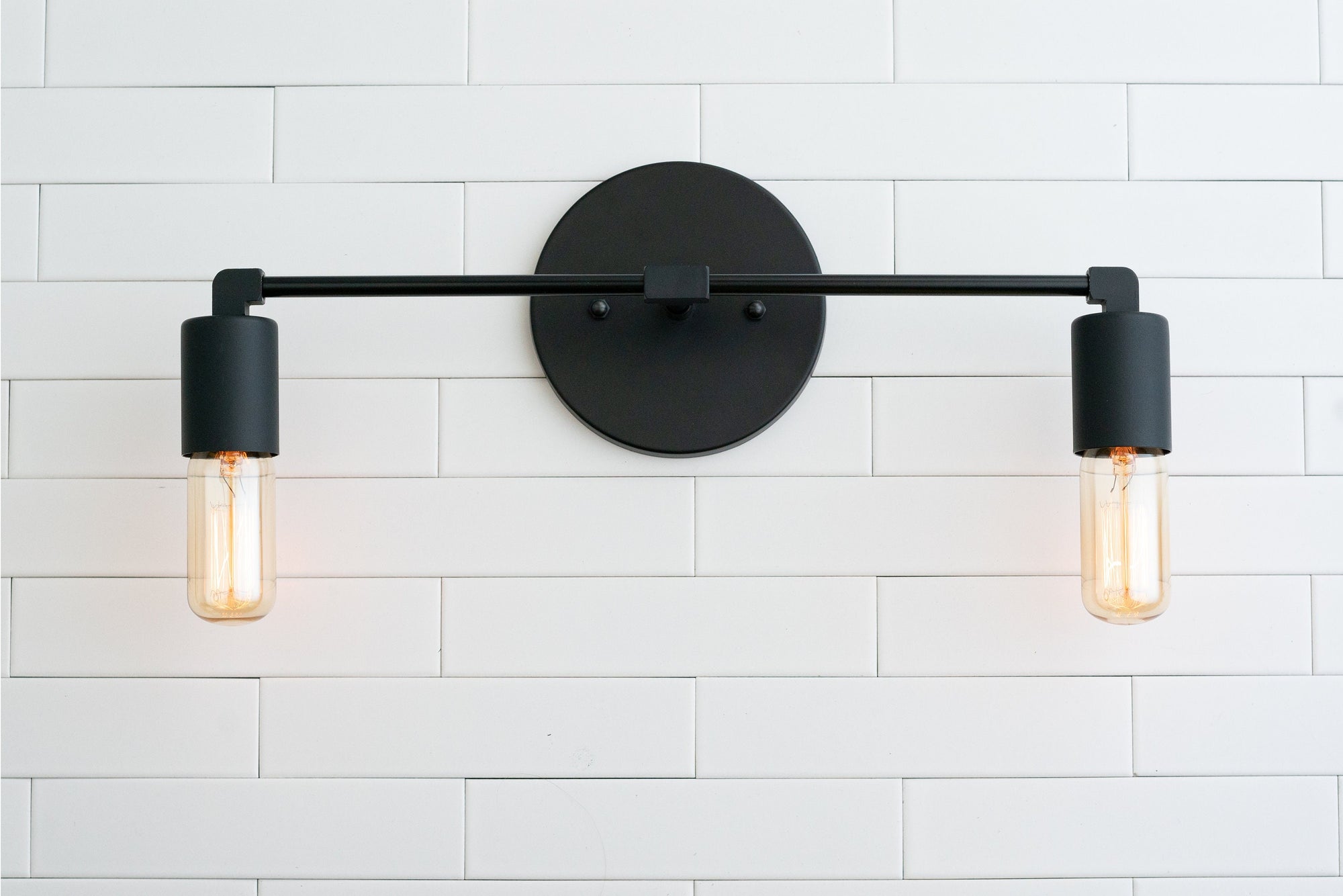 VANITY MODEL No. 3289- Industrial bathroom lighting with a Black finish. Designed and produced by newwineoldbottles at Peared Creation
