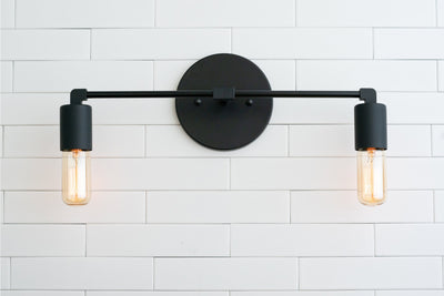VANITY MODEL No. 3289- Industrial bathroom lighting with a Black finish. Designed and produced by newwineoldbottles at Peared Creation