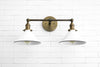 SCONCE MODEL No. 2362- Industrial bathroom lighting with a Antique Brass finish. Designed and produced by newwineoldbottles at Peared Creation