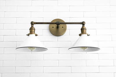 SCONCE MODEL No. 2362- Industrial bathroom lighting with a Antique Brass finish. Designed and produced by newwineoldbottles at Peared Creation