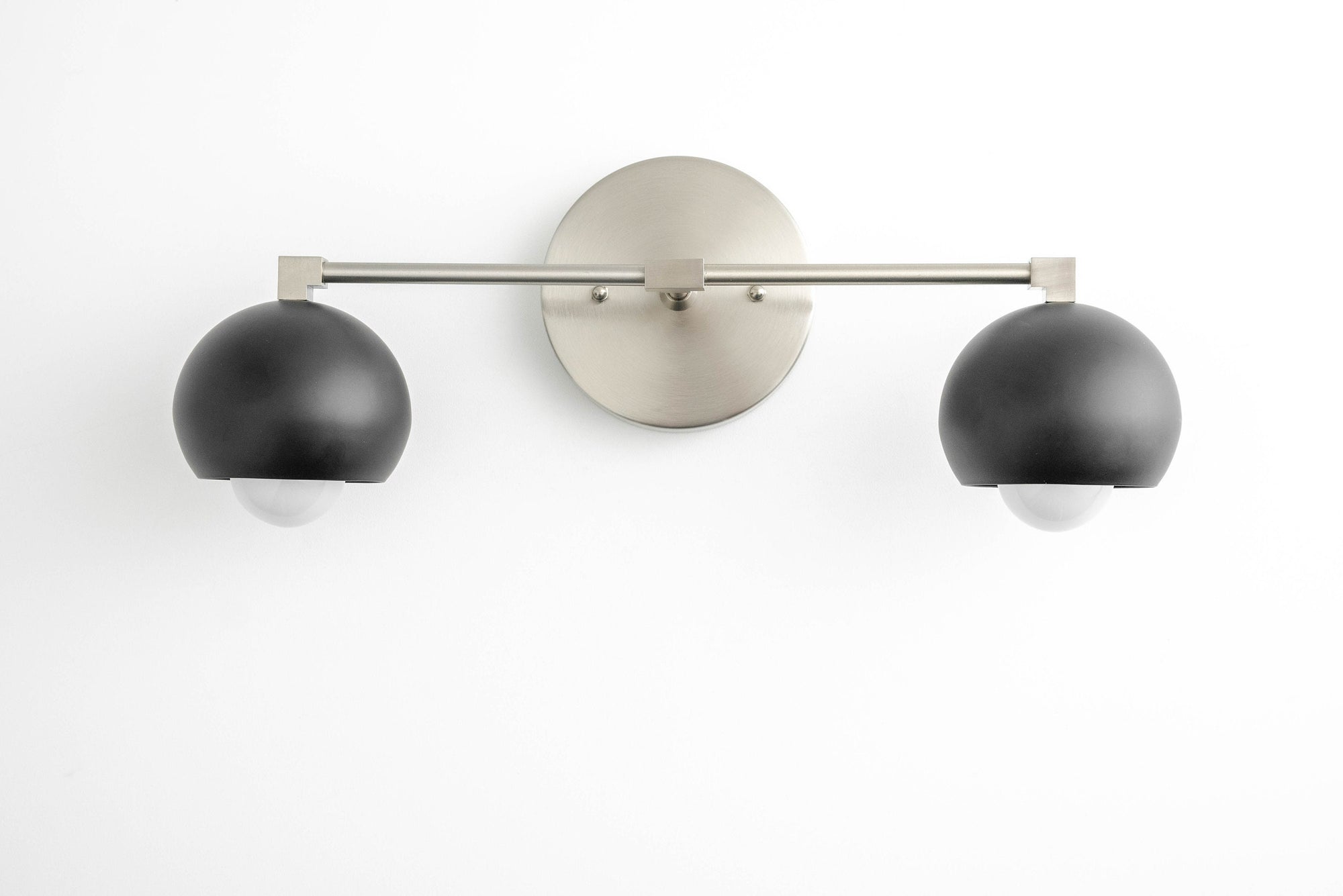 Mid-century modern 2-bulb vanity light with black dome shades and brushed nickel finish mount. - VANITY LIGHT MODEL NO. 5469