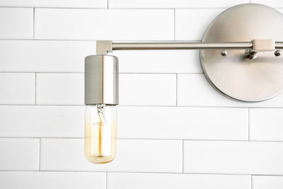 VANITY MODEL No. 3289- Industrial bathroom lighting with a Brushed Nickel finish. Designed and produced by newwineoldbottles at Peared Creation