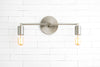 VANITY MODEL No. 3289- Industrial bathroom lighting with a Brushed Nickel finish. Designed and produced by newwineoldbottles at Peared Creation