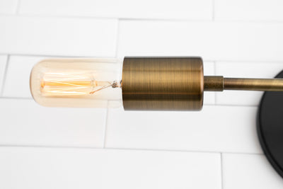 VANITY MODEL No. 5109- Industrial bathroom lighting with a Black/Antique Brass finish. Designed and produced by newwineoldbottles at Peared Creation
