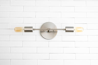 VANITY MODEL No. 5109- Industrial bathroom lighting with a Brushed Nickel finish. Designed and produced by newwineoldbottles at Peared Creation