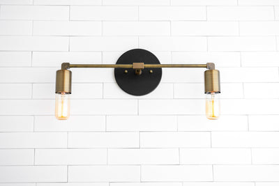 VANITY MODEL No. 3289- Industrial bathroom lighting with a Black/Antique Brass finish. Designed and produced by newwineoldbottles at Peared Creation