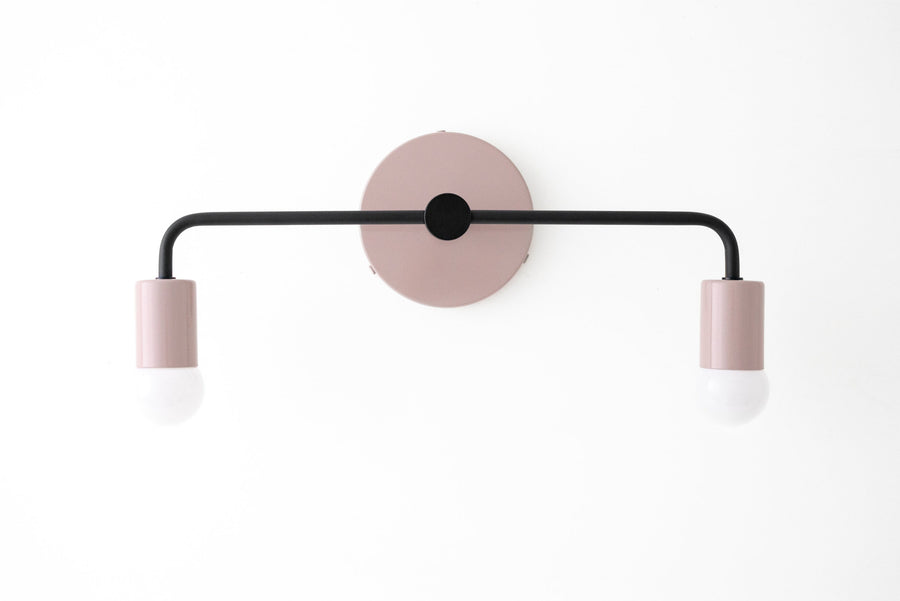 Mauve Scandinavian vanity light with black metal rod and two bare bulbs. - VANITY LIGHT MODEL NO. 1071