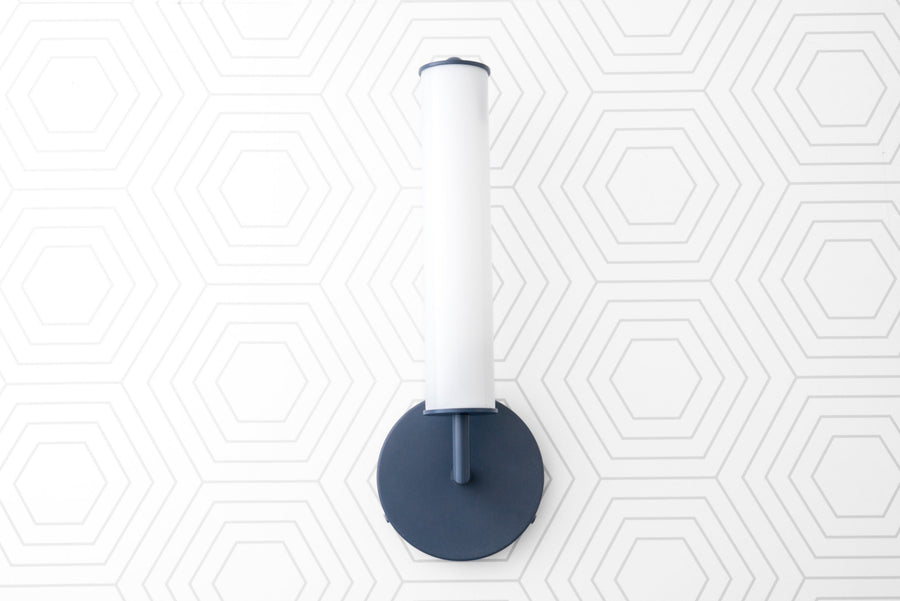 Coal blue wall sconce with tall white cylindrical glass globe and round backplate. - SCONCE MODEL NO. 6612