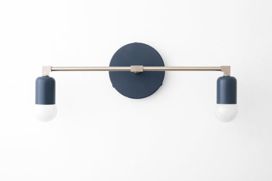 Mid-century modern vanity light with coal blue cylindrical shades and brushed nickel horizontal bar. - VANITY LIGHT MODEL NO. 0026